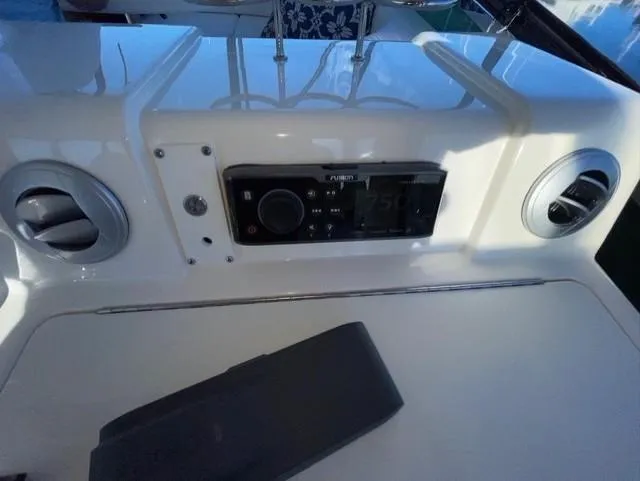 Slide: The Image of Control panel of 2010 Sea Ray 520 Sedan Bridge yacht with audio system. - 15