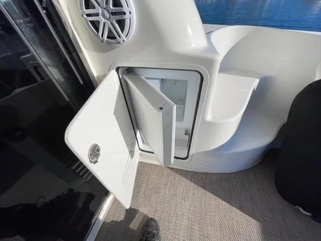 Slide: The Image of Open storage compartment on 2010 Sea Ray 520 Sedan Bridge yacht deck. - 16