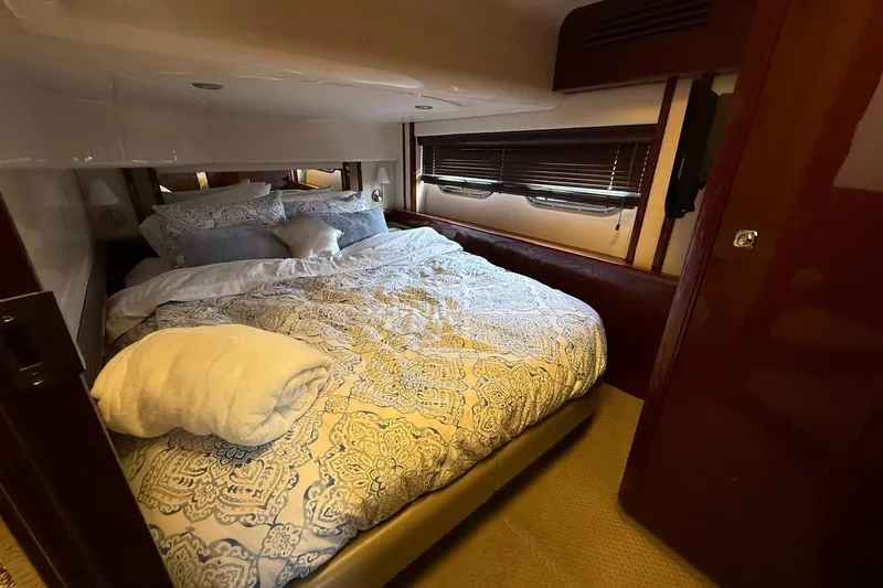 Slide: The Image of Luxurious bedroom interior of 2010 Sea Ray 520 Sedan Bridge yacht. - 23