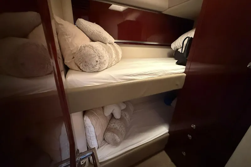 Slide: The Image of Bunk beds in 2010 Sea Ray 520 Sedan Bridge yacht cabin with plush pillows. - 24