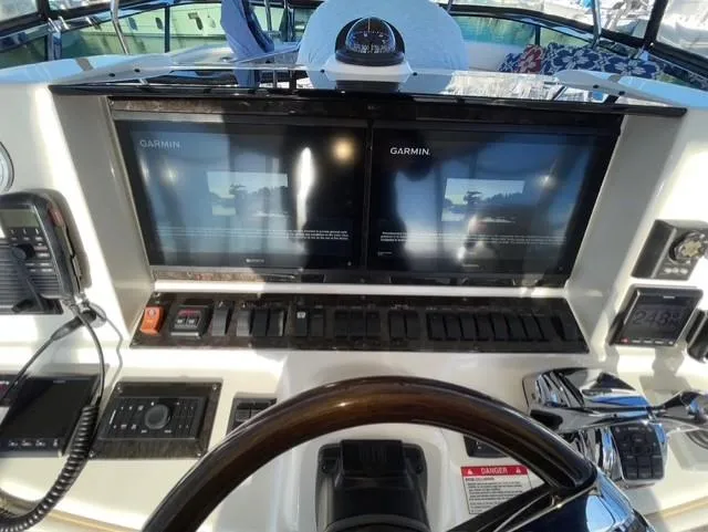 Slide: The Image of Helm of 2010 Sea Ray 520 Sedan Bridge with Garmin navigation displays. - 9