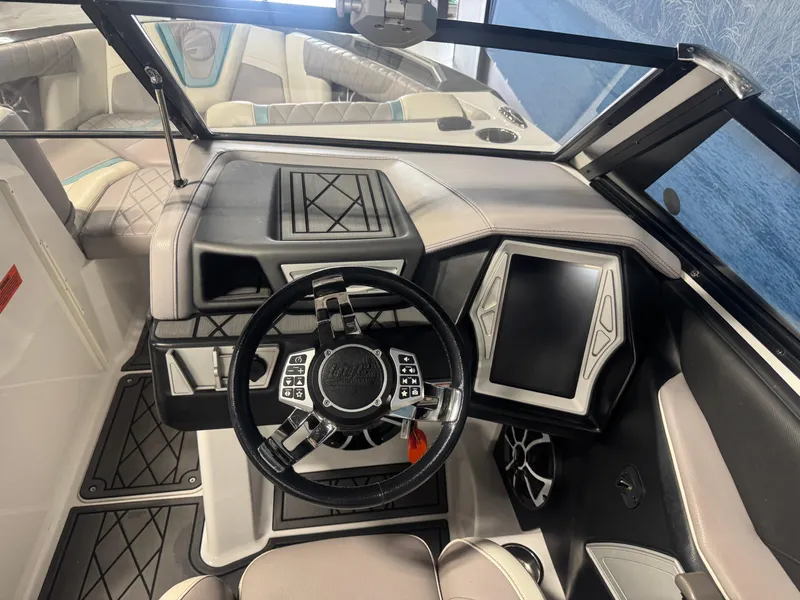 Slide: The Image of 2019 Tigé ZX1 boat interior with modern dashboard and steering wheel. - 11