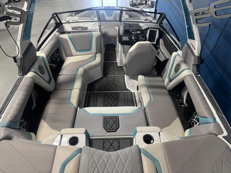 Slide: The Image of 2019 Tigé ZX1 boat interior with luxurious seating and modern dashboard design. - 6