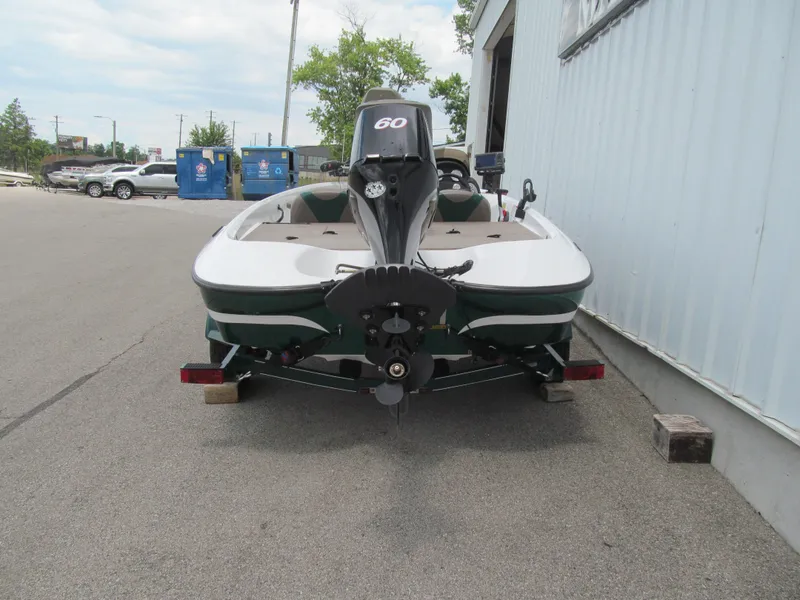 Slide: The Image of 2006 Nitro 640 LX boat on trailer, parked outside a building. - 3