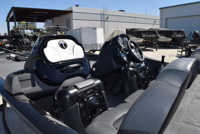 Slide: The Image of 2022 Tracker Pro Team 175 TXW boat interior with steering console and seating. - 3