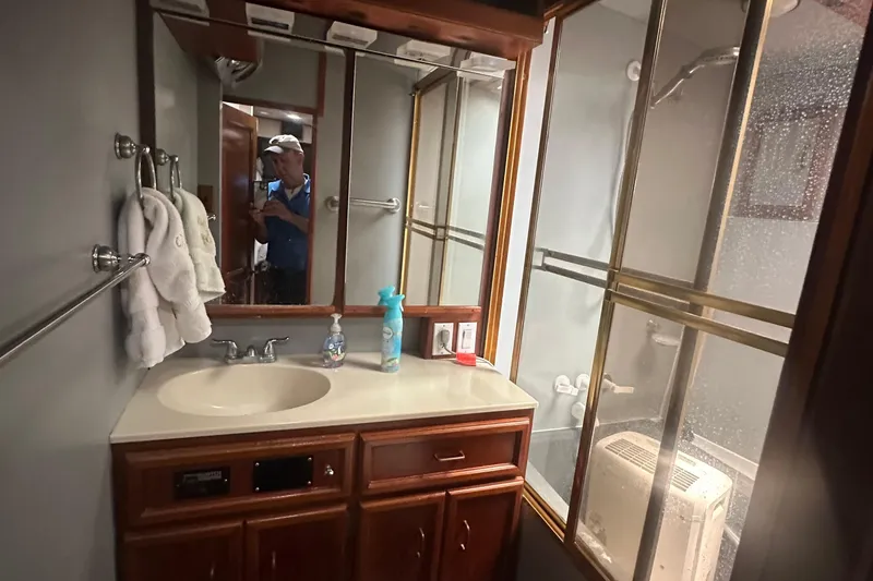 Slide: The Image of Bathroom interior of 1986 Egg Harbor SPORT FISHER yacht with sink and shower. - 13