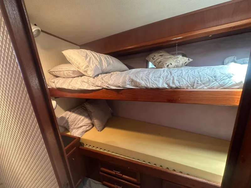 Slide: The Image of Interior of 1986 Egg Harbor SPORT FISHER with cozy bunk beds and wooden accents. - 15