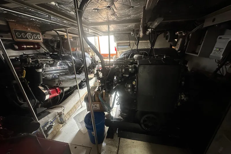 Slide: The Image of Engine room of a 1986 Egg Harbor SPORT FISHER boat, showcasing machinery and equipment. - 29