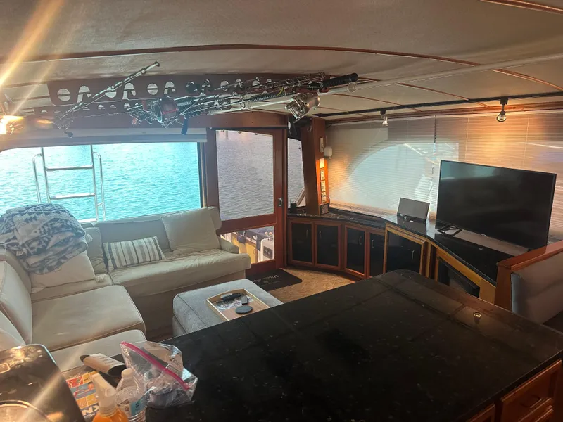 Slide: The Image of Interior of 1986 Egg Harbor SPORT FISHER yacht with cozy seating and TV. - 5