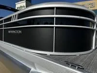 The Image of 2025 Bennington 25 SXSR pontoon boat with sleek black and silver design. - 1