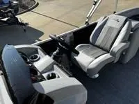 Slide: The Image of 2025 Bennington 25 SXSR boat interior with modern seating and dashboard. - 11