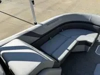 Slide: The Image of 2025 Bennington 25 SXSR boat interior with sleek gray seating and modern design. - 13