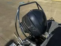 Slide: The Image of 2025 Bennington 25 SXSR boat engine with protective frame on a sunny day. - 15