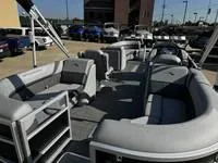 Slide: The Image of 2025 Bennington 25 SXSR pontoon boat with spacious seating and modern design. - 16