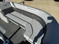 Slide: The Image of 2025 Bennington 25 SXSR boat interior with gray seating and modern design. - 9