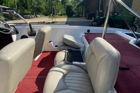 Slide: The Image of 2000 ProCraft 170 Combo boat interior with red carpet and beige seating. - 3