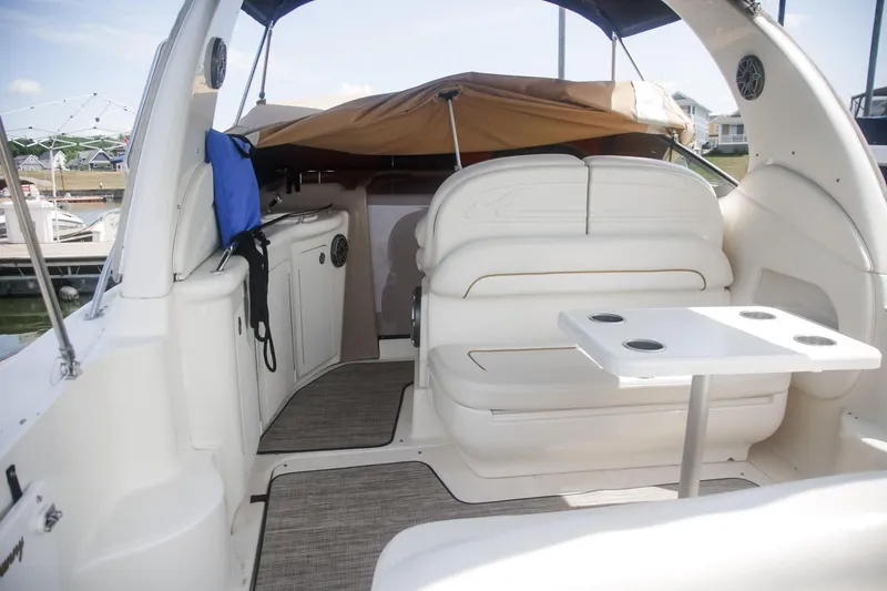 Slide: The Image of Interior of 2002 Sea Ray 300 Sundancer boat with seating and table. - 5