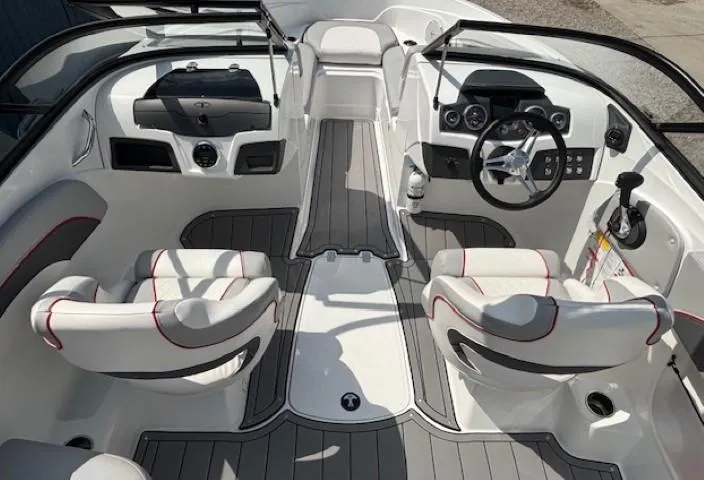 Slide: The Image of 2021 Tahoe 700 boat interior with sleek design, modern dashboard, and comfortable seating. - 12