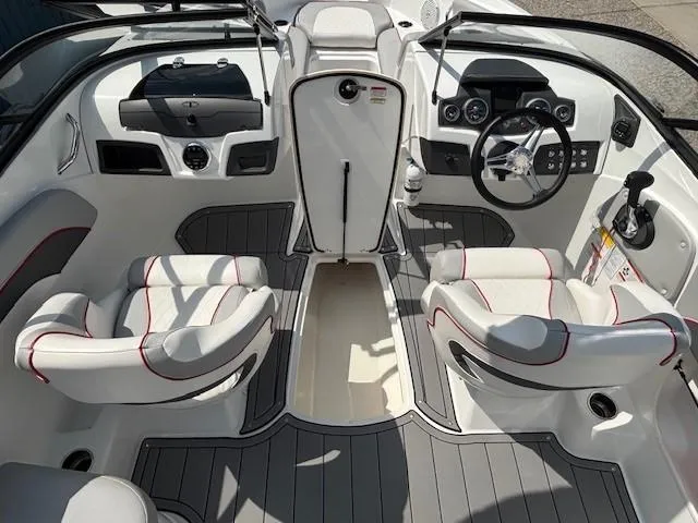 Slide: The Image of Interior of 2021 Tahoe 700 boat with modern dashboard and seating. - 13