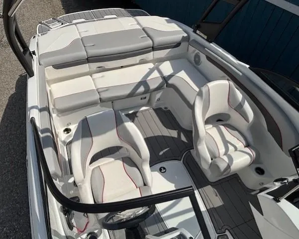 Slide: The Image of 2021 Tahoe 700 boat interior with white and gray seating, modern design, and spacious layout. - 22