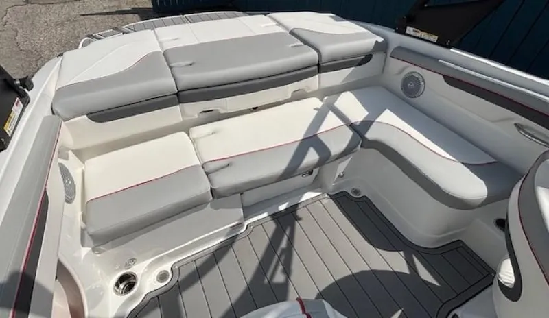 Slide: The Image of 2021 Tahoe 700 boat interior with gray and white cushioned seating. - 23