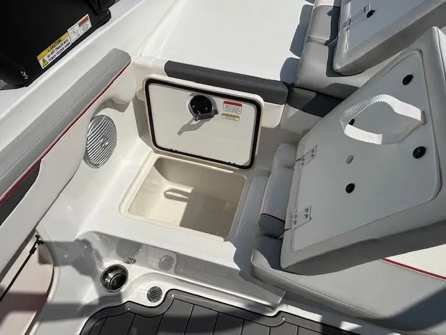 Slide: The Image of 2021 Tahoe 700 boat interior with open storage compartment and seating. - 26