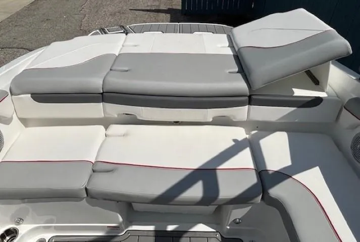 Slide: The Image of 2021 Tahoe 700 boat interior with gray and white cushioned seating. - 29