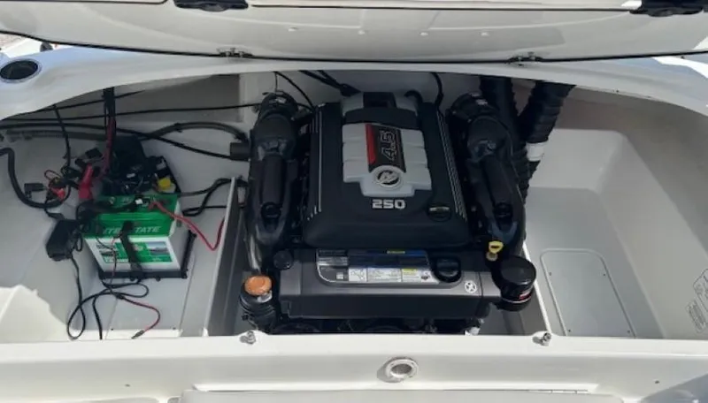 Slide: The Image of 2021 Tahoe 700 boat engine compartment with battery and wiring. - 30