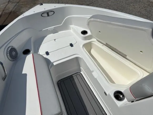 Slide: The Image of 2021 Tahoe 700 boat interior with open storage compartment and seating area. - 9