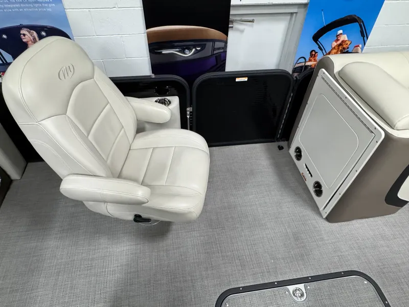 Slide: The Image of Luxurious seating in 2020 Manitou 23 Oasis RF boat interior. - 13