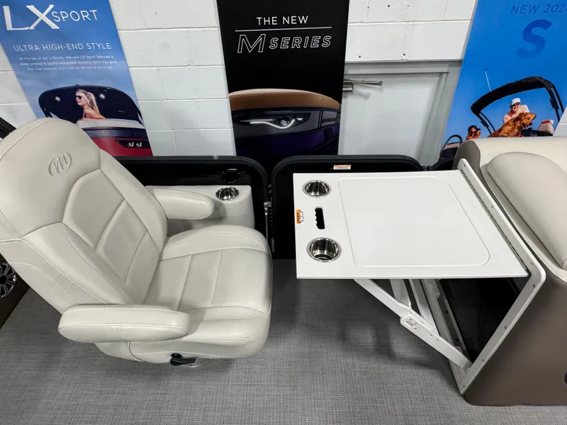Slide: The Image of Luxurious seating and table setup in 2020 Manitou 23 Oasis RF boat. - 14