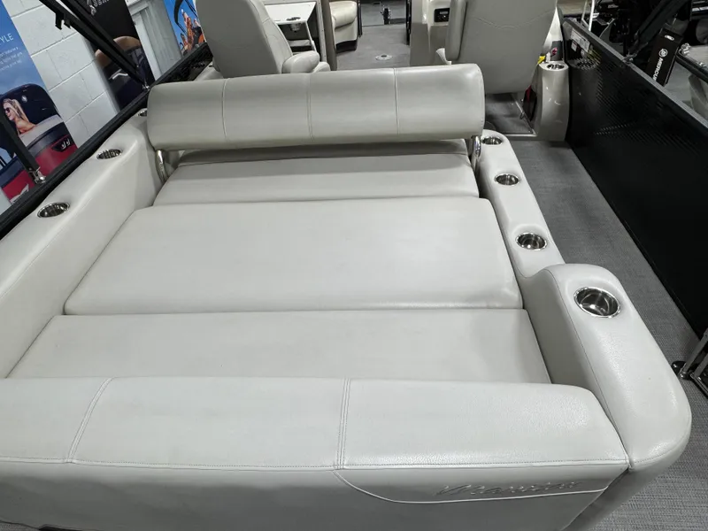 Slide: The Image of Luxurious seating on 2020 Manitou 23 Oasis RF boat with cup holders. - 16
