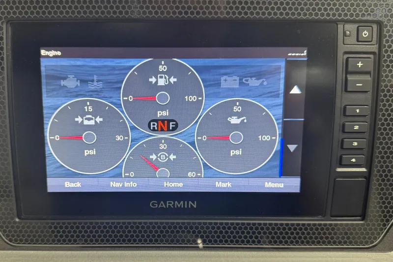 Slide: The Image of Garmin display showing engine diagnostics on a 2020 Manitou 23 Oasis RF boat. - 19