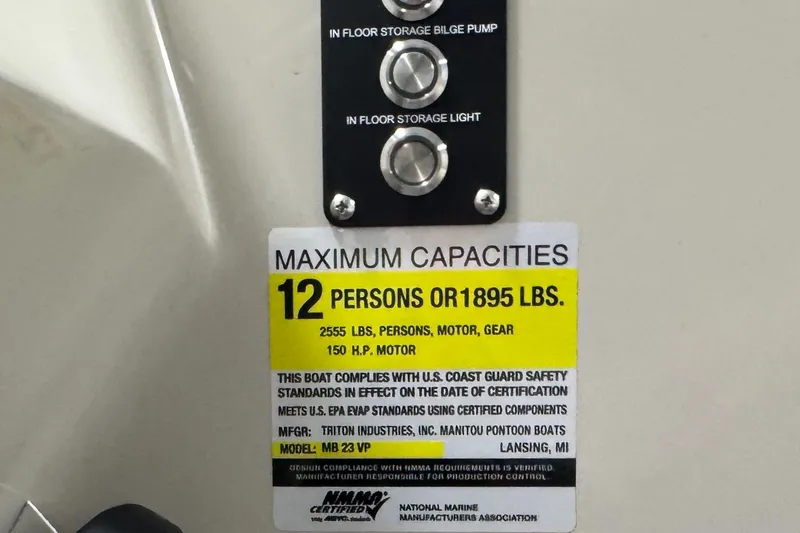 Slide: The Image of Capacity label on 2020 Manitou 23 Oasis RF, max 12 persons or 1895 lbs. - 22