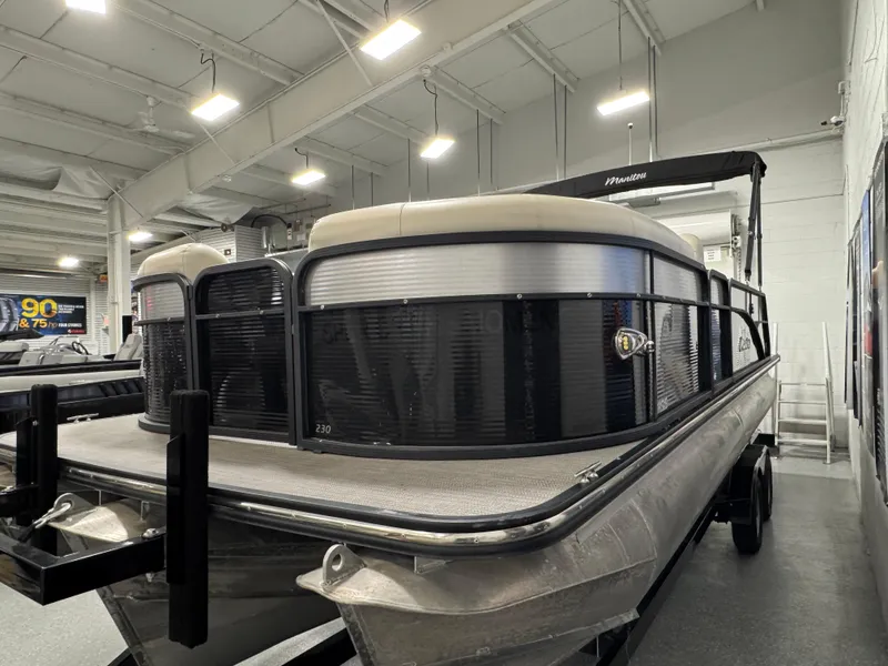 Slide: The Image of 2020 Manitou 23 Oasis RF pontoon boat in indoor showroom. - 7