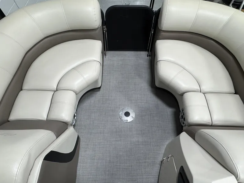 Slide: The Image of Luxurious seating on 2020 Manitou 23 Oasis RF pontoon boat, featuring plush beige upholstery. - 8
