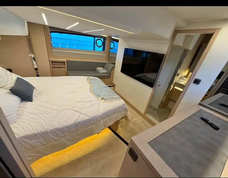 Slide: The Image of Luxurious bedroom interior of 2023 Prestige 520S yacht with modern amenities and elegant design. - 6