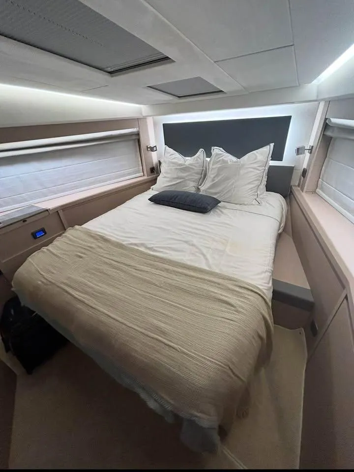 Slide: The Image of Luxurious bedroom interior of 2023 Prestige 520S yacht with modern design and cozy bedding. - 7