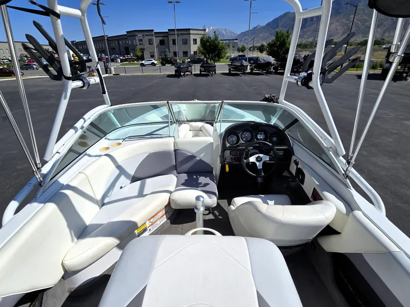 Slide: The Image of Interior of a 2000 Toyota Epic 22 boat with white seating and steering wheel. - 15