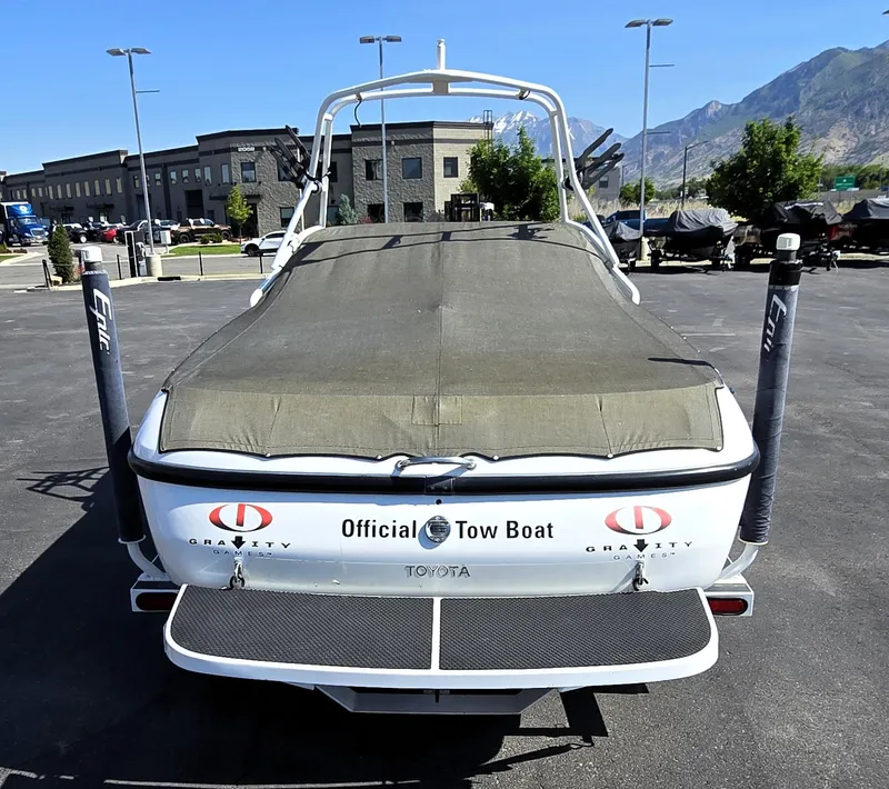 Slide: The Image of 2000 Toyota Epic 22 tow boat with cover, parked outdoors. - 5