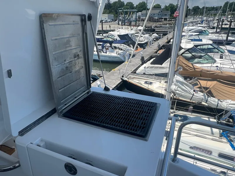Slide: The Image of Outdoor grill on 2011 Hatteras 60 Motor Yacht, docked at marina with boats. - 21
