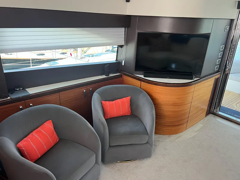 Slide: The Image of Luxurious interior of 2011 Hatteras 60 Motor Yacht with modern seating and entertainment area. - 4