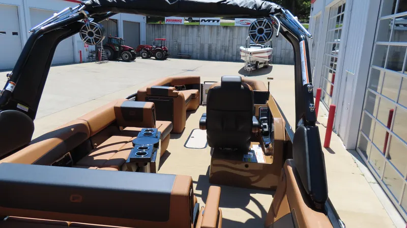 Slide: The Image of 2025 Princecraft Vogue 27 RL pontoon boat interior with luxurious seating and modern design. - 11