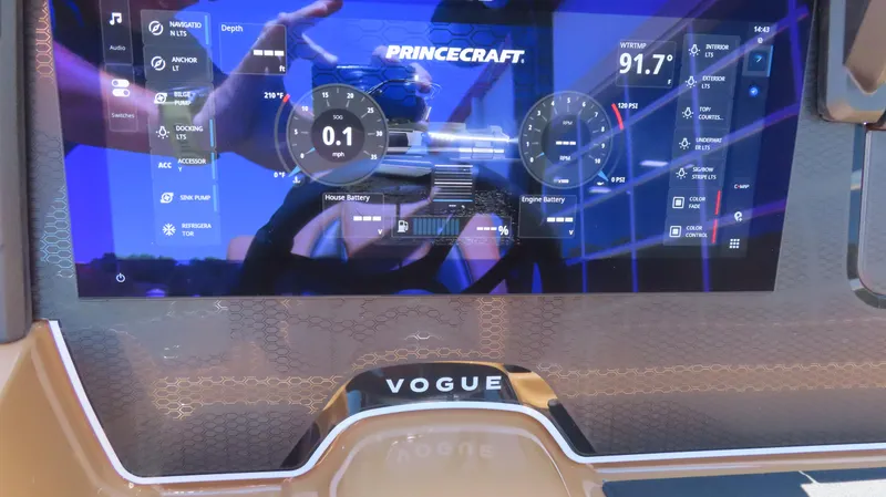 Slide: The Image of Dashboard of 2025 Princecraft Vogue 27 RL boat with digital display and controls. - 12