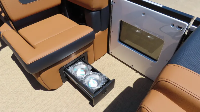 Slide: The Image of 2025 Princecraft Vogue 27 RL interior with storage drawer and seating. - 16