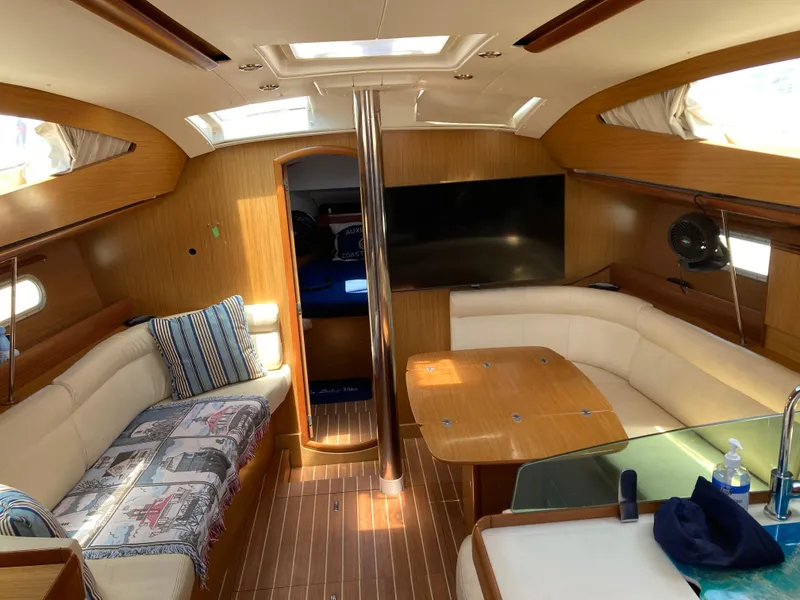Slide: The Image of Interior of 2008 Jeanneau Sun Odyssey 42 DS yacht with cozy seating and wooden finishes. - 15