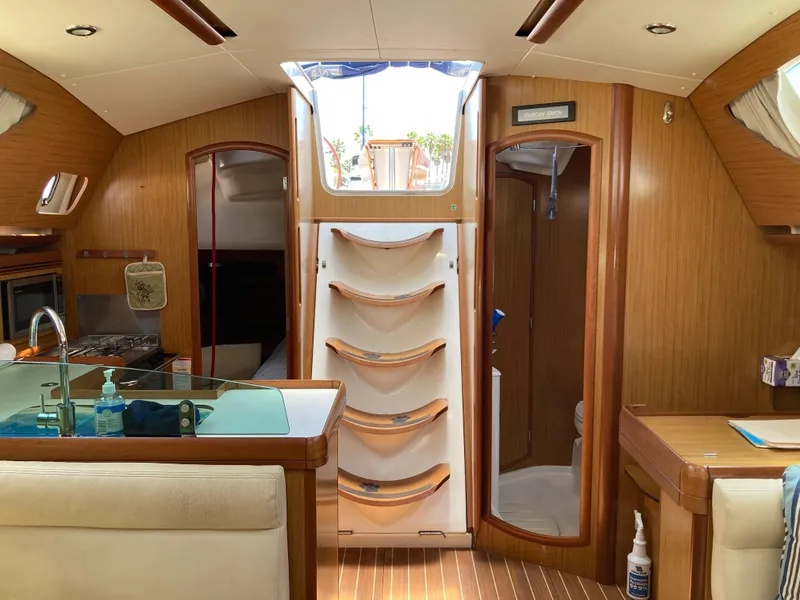 Slide: The Image of Interior of 2008 Jeanneau Sun Odyssey 42 DS sailboat with wood finish and modern amenities. - 16
