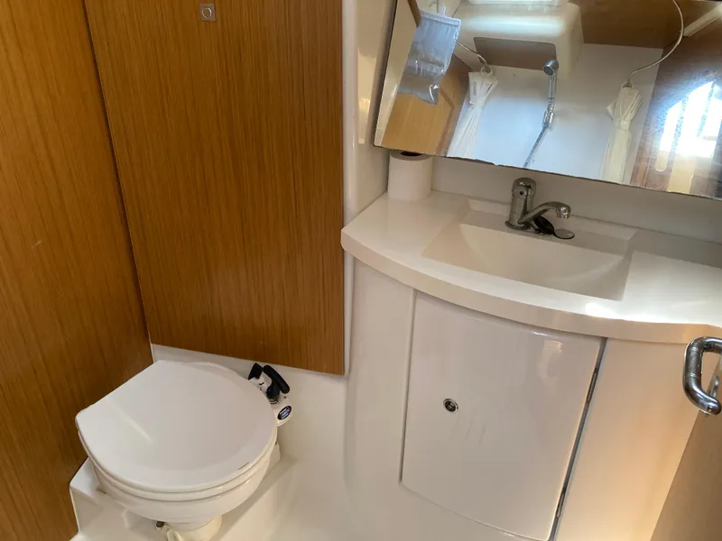 Slide: The Image of Bathroom interior of 2008 Jeanneau Sun Odyssey 42 DS yacht, featuring sink and toilet. - 26
