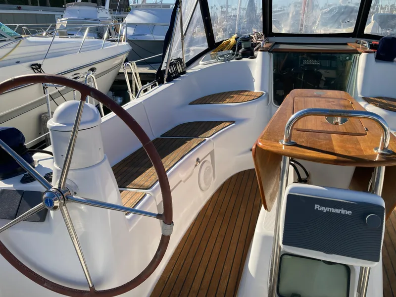 Slide: The Image of Cockpit of 2008 Jeanneau Sun Odyssey 42 DS with steering wheel and Raymarine equipment. - 7