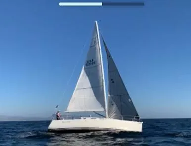 The Image of 2002 J Boats J/109 sailing on open sea under clear blue sky. - 0